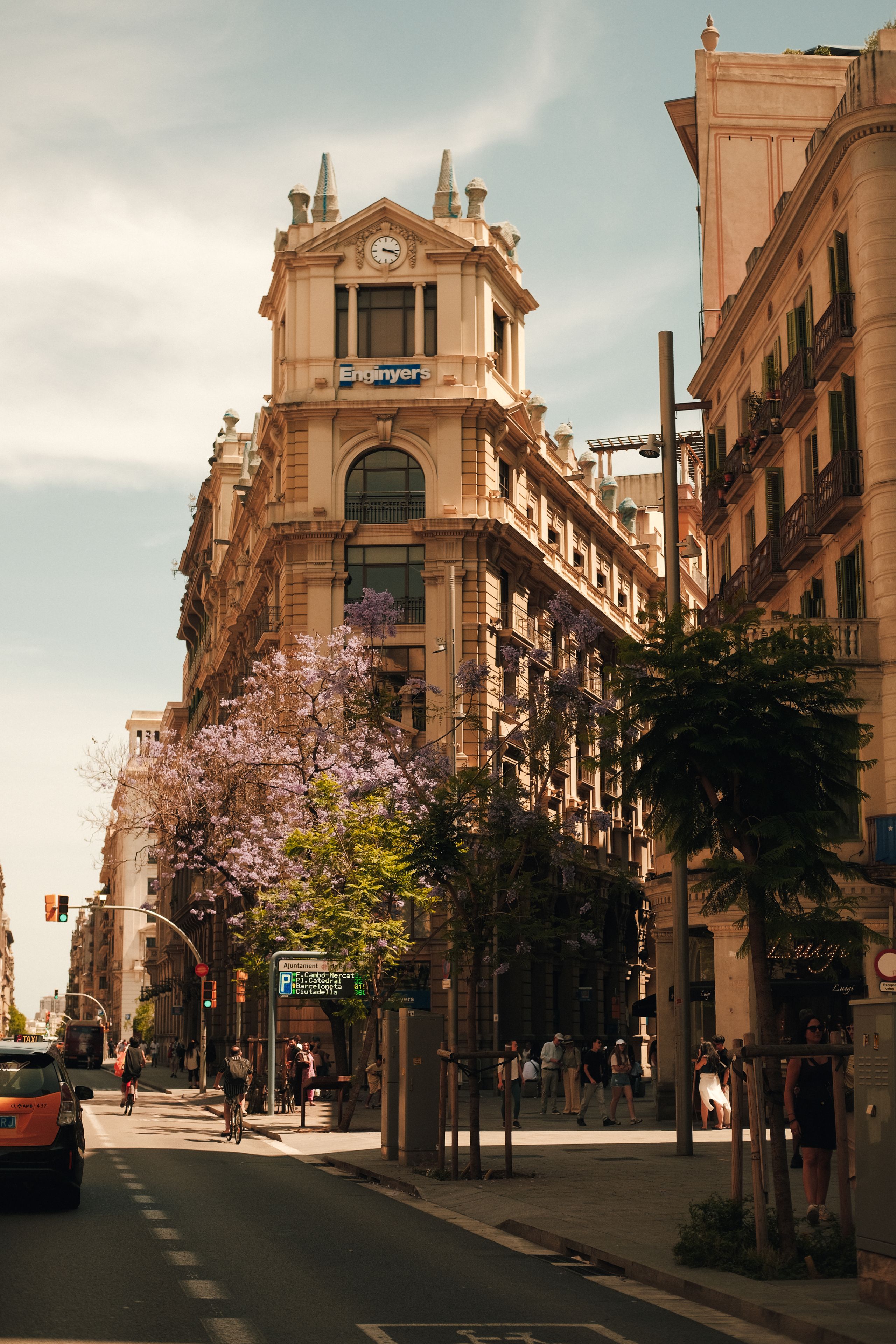 Historic building along a tree-lined street in central Barcelona.