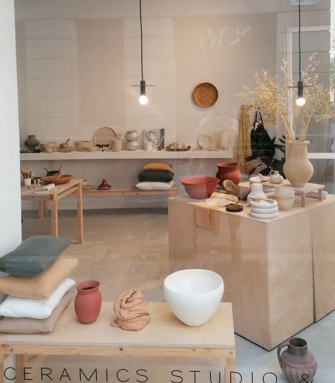 Ceramics and home décor displayed inside Working in the Redwoods studio in Barcelona.